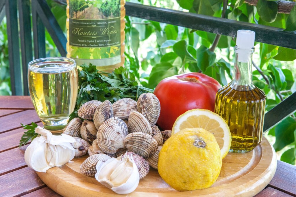 a plate of food and a bottle of wine on a table
