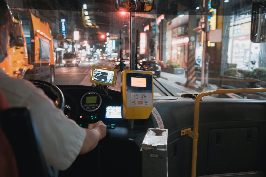 person holding black and yellow digital device