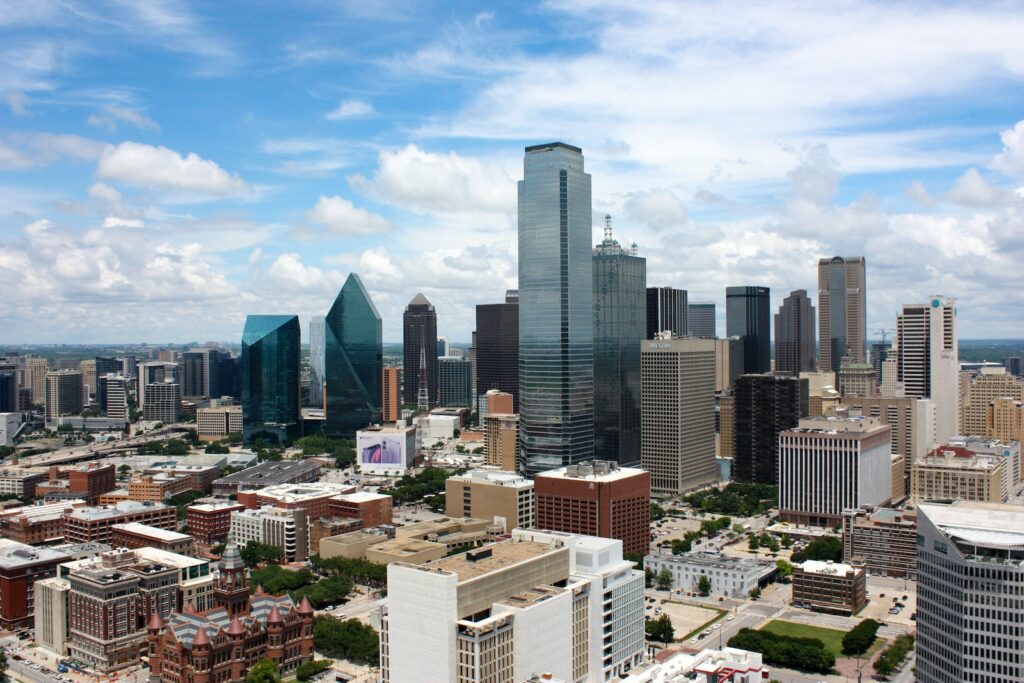 city buildings under blue sky during daytime